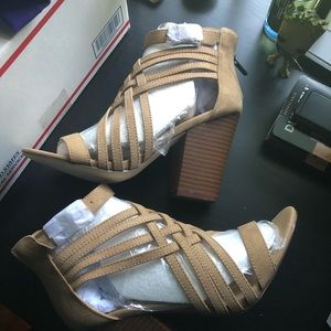 Strapped wedge heel, never worn. Size 7.5-8